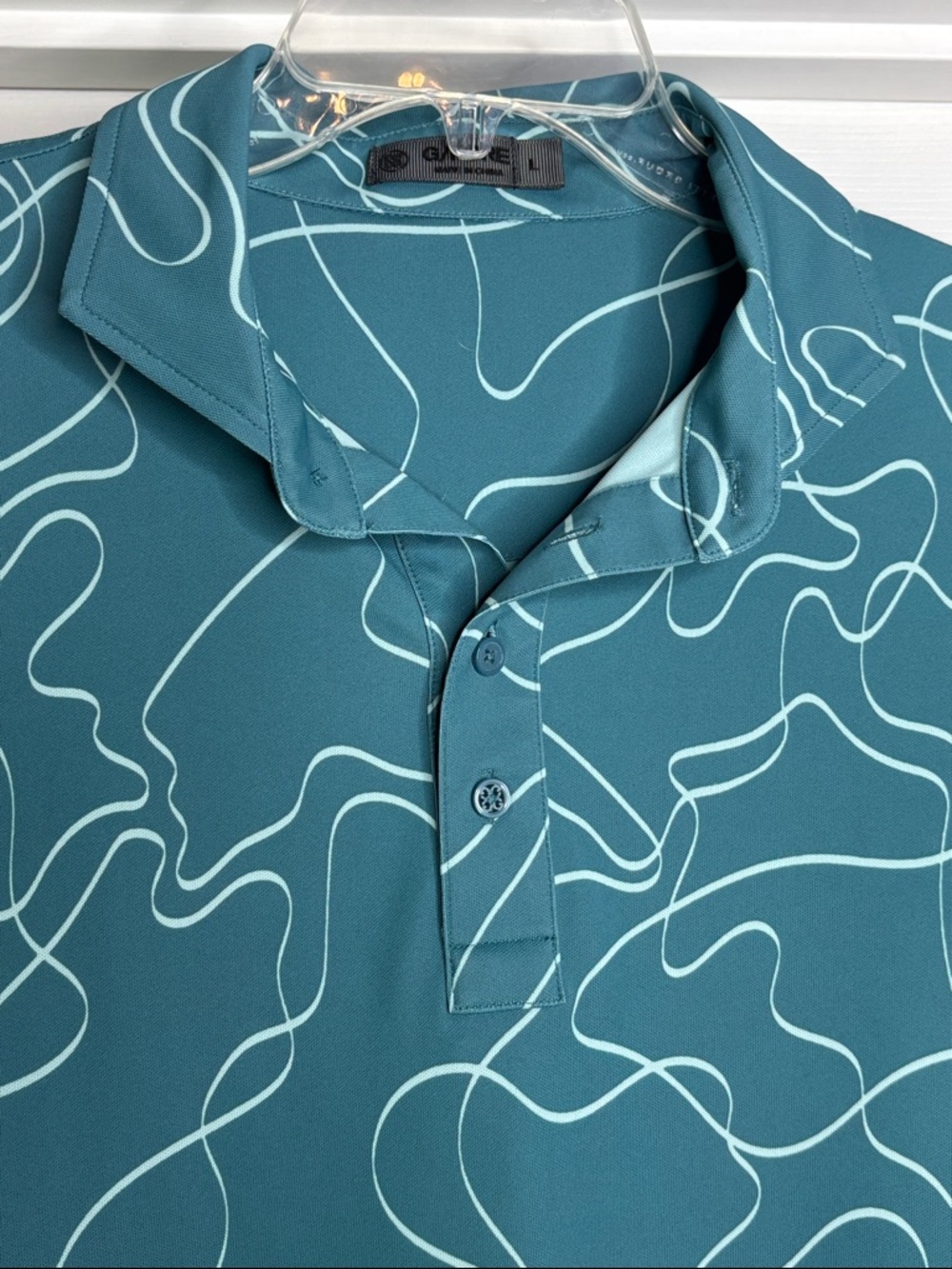 G/FORE Men's Teal Polo with Light Line Abstract Print large NWOT